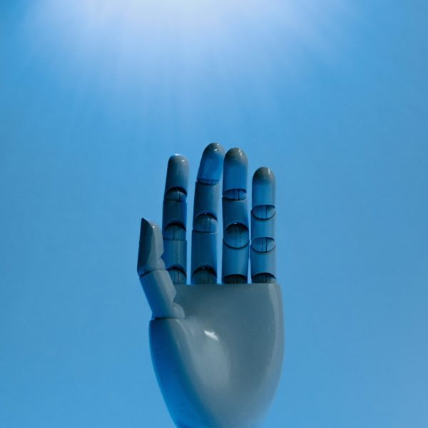 Robot Hand on Blue Background