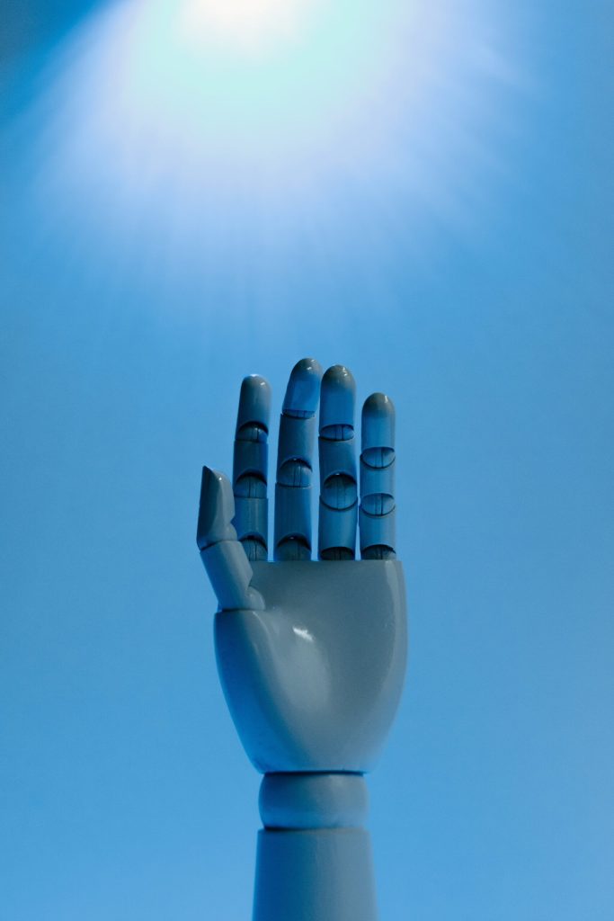 Robot Hand on Blue Background